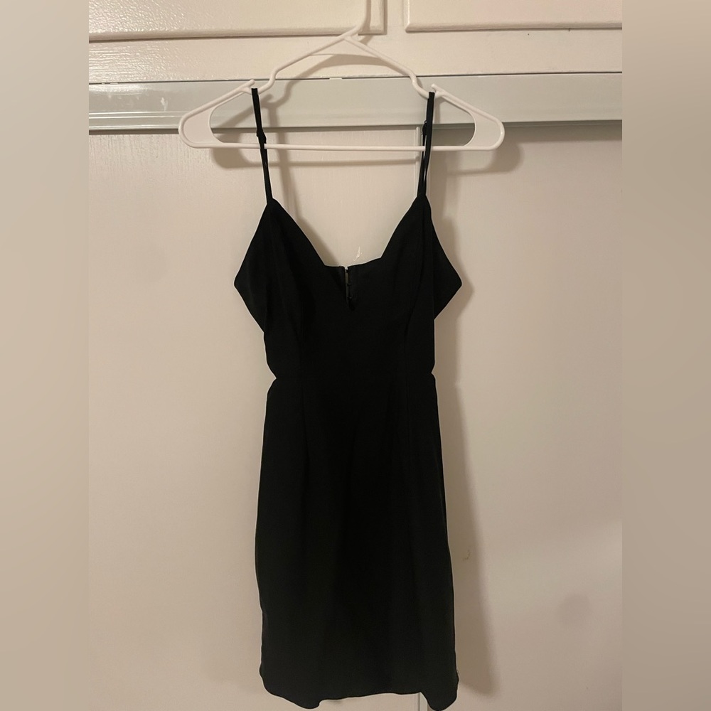 Black mini dress with cute out sides to accentuate curves